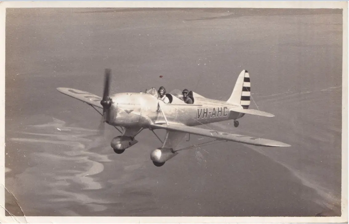 Ryan VH-AHC over the Mackay coastline.